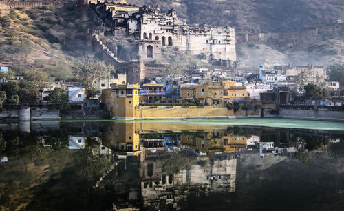 Historic buildings reflected in lake