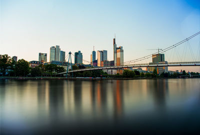 Bridge over river with buildings in background