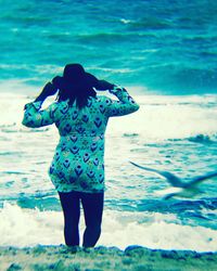 Woman standing on beach