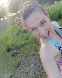 Portrait of smiling young woman in grass