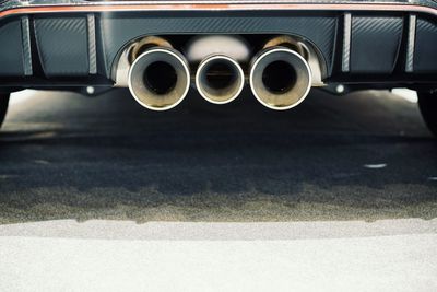 Close-up of vintage car on road