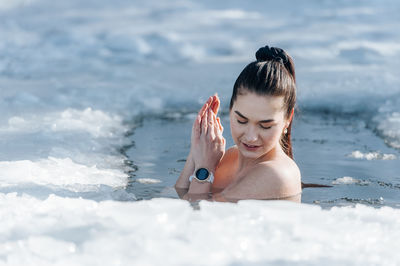 Young woman swimming in sea