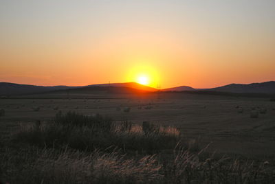 Scenic view of landscape at sunset