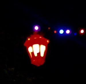 Close-up of illuminated light during night