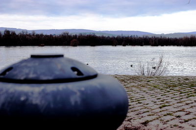 Close-up of lake against sky