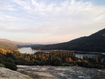 Scenic view of lake against cloudy sky