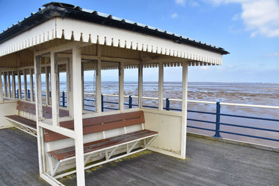 Built structure on beach against sky