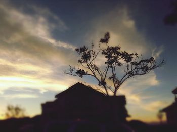Low angle view of building against cloudy sky
