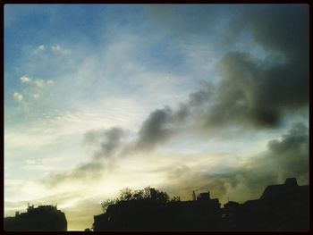 Low angle view of cloudy sky at sunset