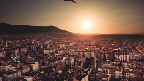 High angle view of city at sunset