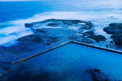 High angle view of swimming pool by sea