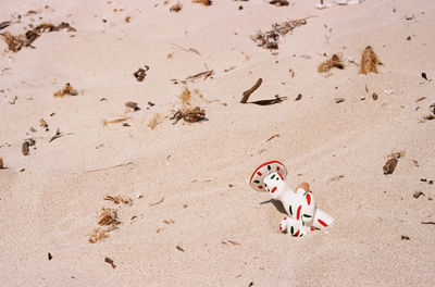 High angle view of toy on sand
