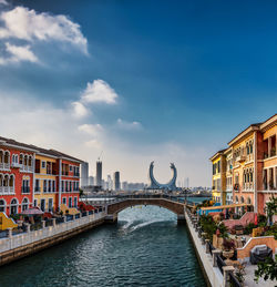 Bridge over river against clear blue sky, qanat cartier, lusail city, the pearl island 