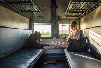 Man traveling by train in india