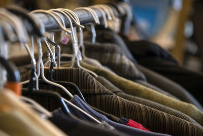 Close-up of clothes hanging on rack
