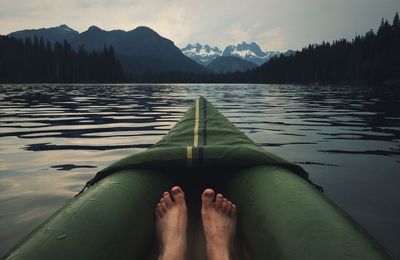 Low section of man in boat in lake