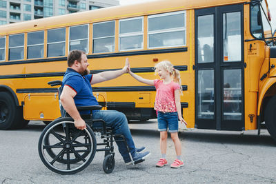 Full length of a girl sitting in bus