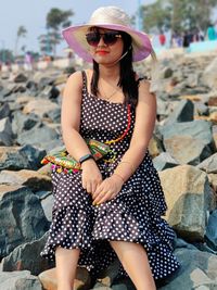 Young woman wearing sunglasses standing outdoors