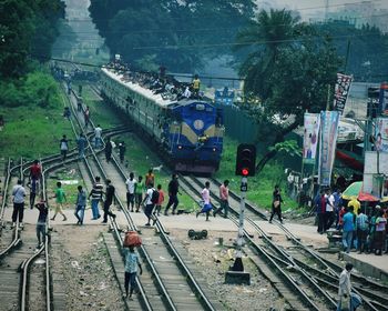 High angle view of people on railroad tracks