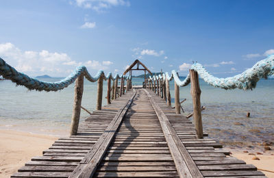 Pier over sea against sky