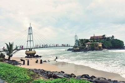 Scenic view of sea against cloudy sky