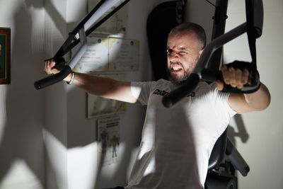 Man exercising in gym