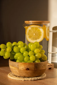 Green grapes lie on eco dish. eco-friendly choice and friendly nature. the concept of world without