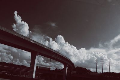 Low angle view of elevated road against sky