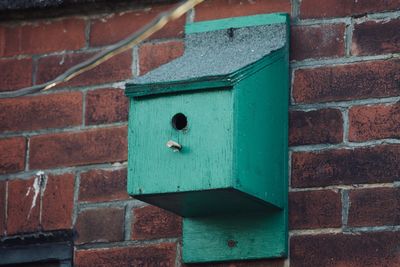 Close-up bird box on  brick wall