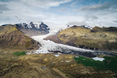 Scenic view of mountains against sky during winter