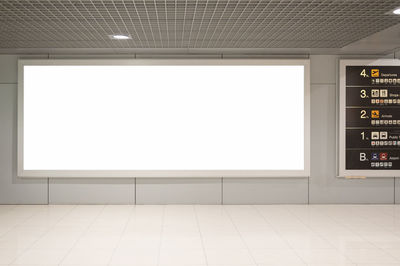 Blank advertising billboard at airport,mockup poster media template ads display	
