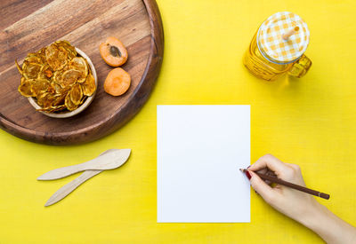 Directly above shot of person preparing food on table