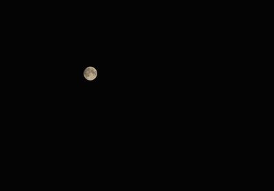 Low angle view of moon against sky at night