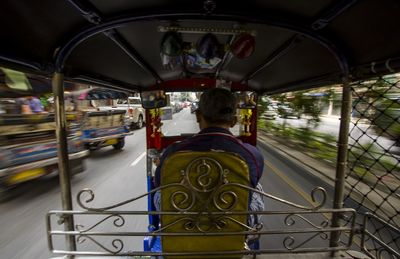 Rear view of man in bus