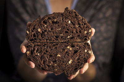 Close-up of hand holding ice cream