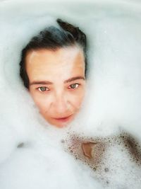 Portrait of smiling young woman in bathroom