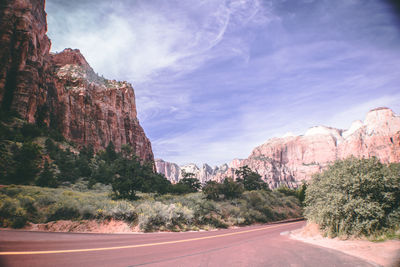 Road passing through rocky mountains