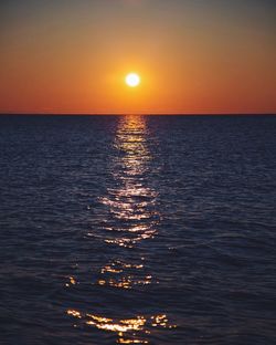 Scenic view of sea at sunset