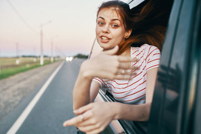 Portrait of beautiful woman in car