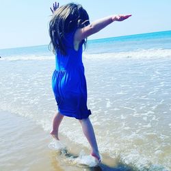 Woman standing on beach