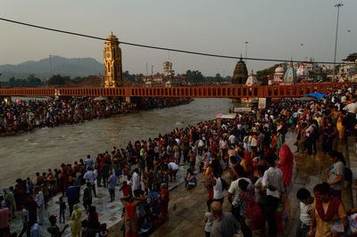 Heavy crowd going to take bath into ganga river due to saavan festival at haridwar bridge temple.