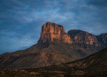 View of rock formations against cloudy sky in guadalupe national park