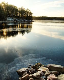 Scenic view of lake against sky during sunset