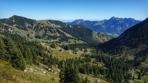 Scenic view of mountains against clear blue sky