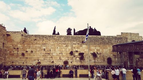 Group of people in front of historical building