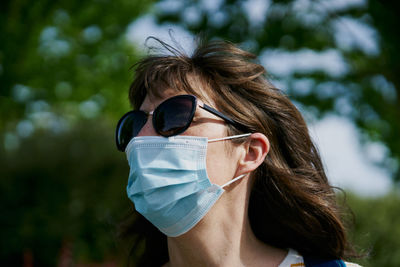 Woman in mask in park