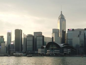 View of skyscrapers against cloudy sky