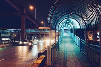 Illuminated bridge at night