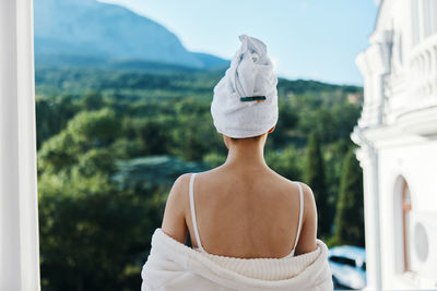 Rear view of woman standing outdoors