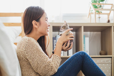 Young woman sitting at home